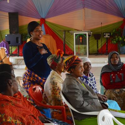 Local women listen to a Projects Abroad women's empowerment workshop. Local women attend a training session hosted by women’s empowerment volunteers in Tanzania.